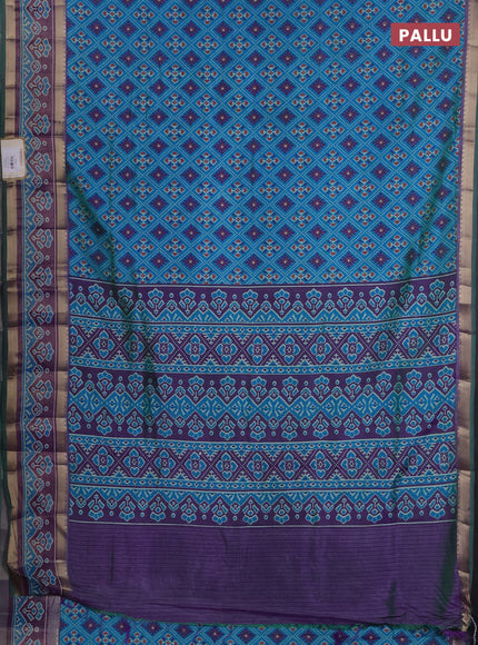 Semi tussar saree dual shade of bluish green and purple with allover ikat prints and ikat zari woven border