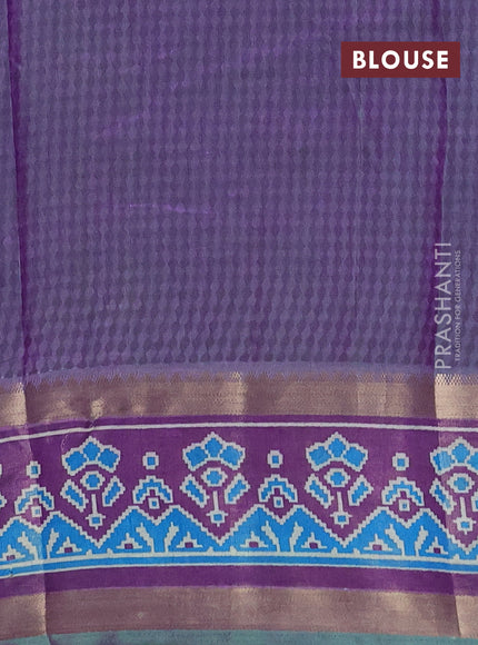 Semi tussar saree dual shade of bluish green and purple with allover ikat prints and ikat zari woven border