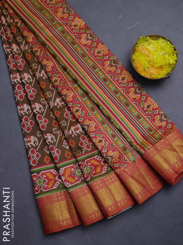 Semi tussar saree mehendi green and rust shade with allover patola prints and zari woven border
