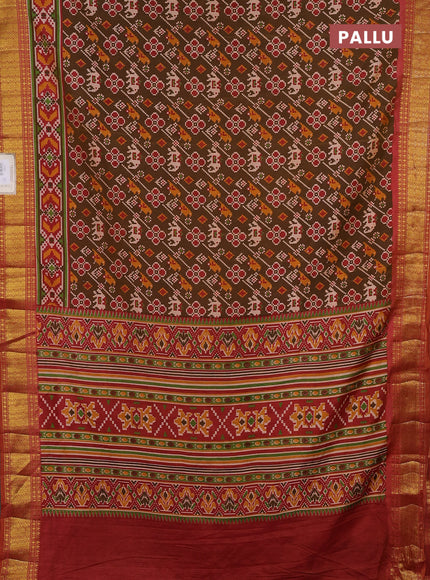 Semi tussar saree mehendi green and rust shade with allover patola prints and zari woven border