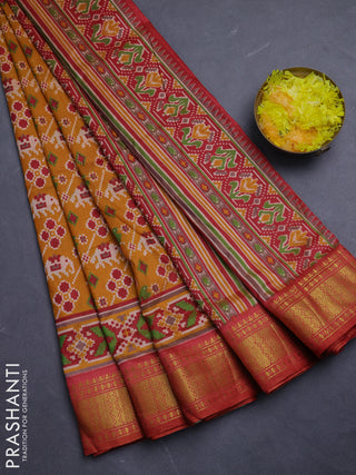 Semi tussar saree mustard yellow and maroon with allover patola prints and zari woven border