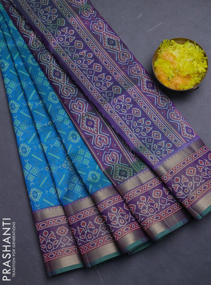 Semi tussar saree dual shade of greeinsh blue and purple with allover ikat prints and ikat zari woven border