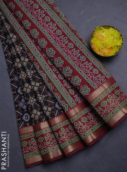 Semi tussar saree black and maroon with allover ikat prints and ikat zari woven border