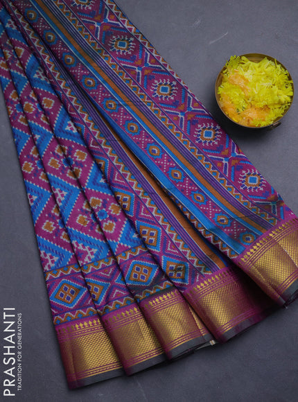 Semi tussar saree dual shade of bluish green and purple with allover ikat prints and zari woven border