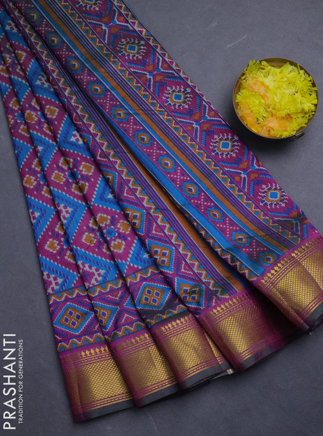 Semi tussar saree dual shade of bluish green and purple with allover ikat prints and zari woven border