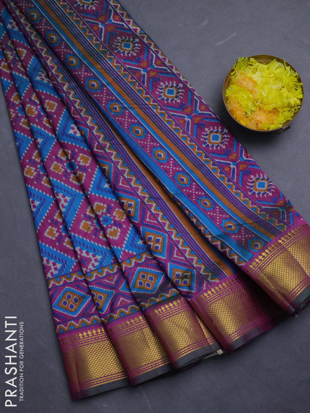 Semi tussar saree dual shade of bluish green and purple with allover ikat prints and zari woven border