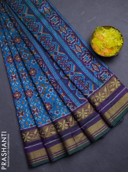 Semi tussar saree dual shade of bluish green and purple with allover ikat prints and ikat woven zari border