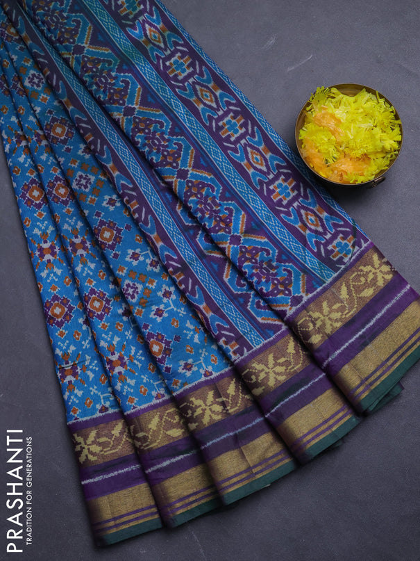 Semi tussar saree dual shade of bluish green and purple with allover ikat prints and ikat woven zari border
