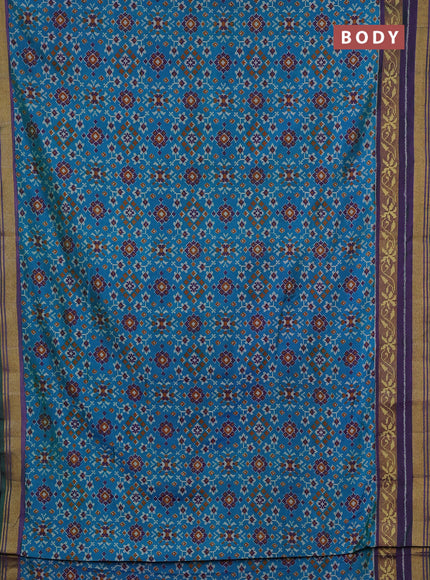 Semi tussar saree dual shade of bluish green and purple with allover ikat prints and ikat woven zari border