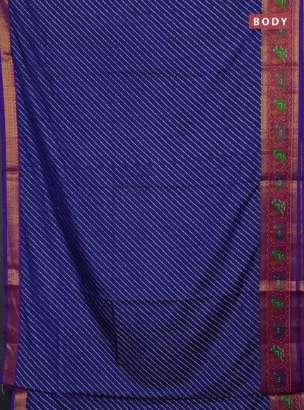Semi tussar saree indigo blue and purple with allover leheriya style ikat weaves and ikat woven zari border