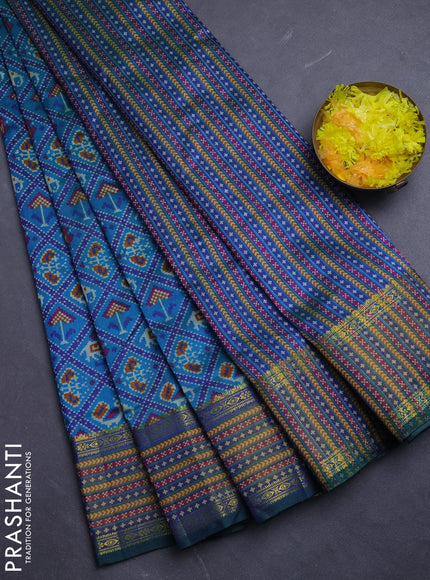 Semi tussar saree dual shade of bluish green and green with allover patola prints and ikat woven zari border