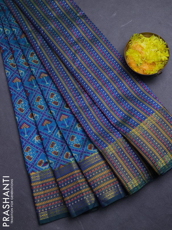 Semi tussar saree dual shade of bluish green and green with allover patola prints and ikat woven zari border