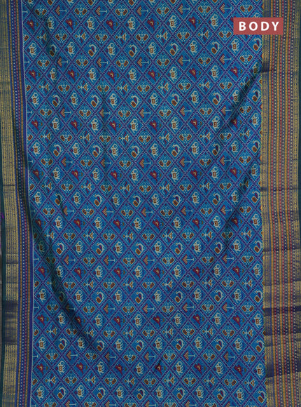 Semi tussar saree dual shade of bluish green and green with allover patola prints and ikat woven zari border