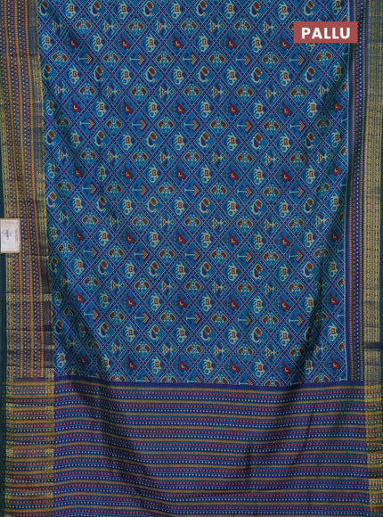 Semi tussar saree dual shade of bluish green and green with allover patola prints and ikat woven zari border
