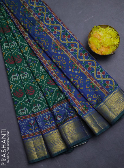 Semi tussar saree green and blue with allover patola prints and zari woven border