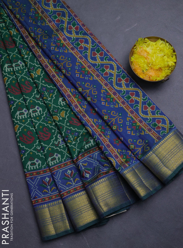 Semi tussar saree green and blue with allover patola prints and zari woven border