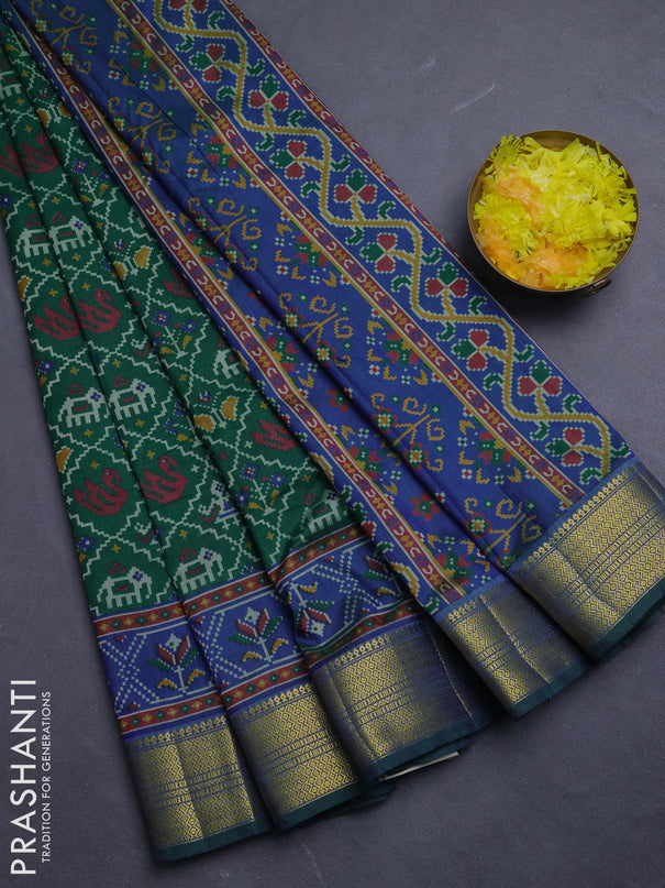 Semi tussar saree green and blue with allover patola prints and zari woven border