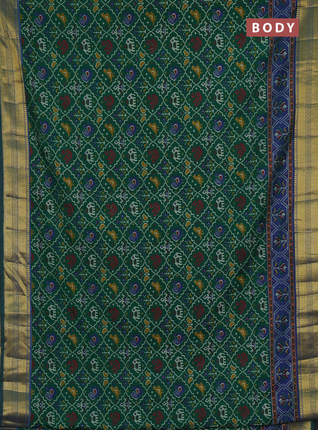 Semi tussar saree green and blue with allover patola prints and zari woven border