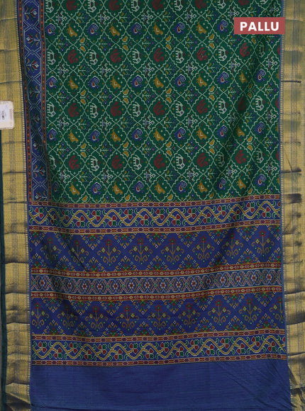 Semi tussar saree green and blue with allover patola prints and zari woven border