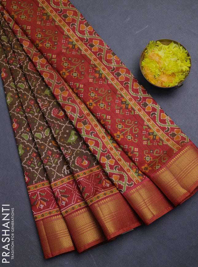 Semi tussar saree mehendi green and rust shade with allover patola prints and zari woven border