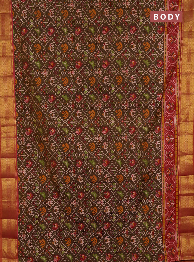 Semi tussar saree mehendi green and rust shade with allover patola prints and zari woven border