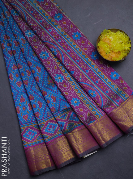 Semi tussar saree dual shade of bluish green and green with allover ikat prints and zari woven border