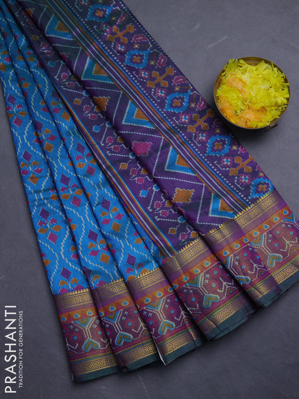 Semi tussar saree dual shade of bluish green and purple with allover ikat prints and ikat woven zari border
