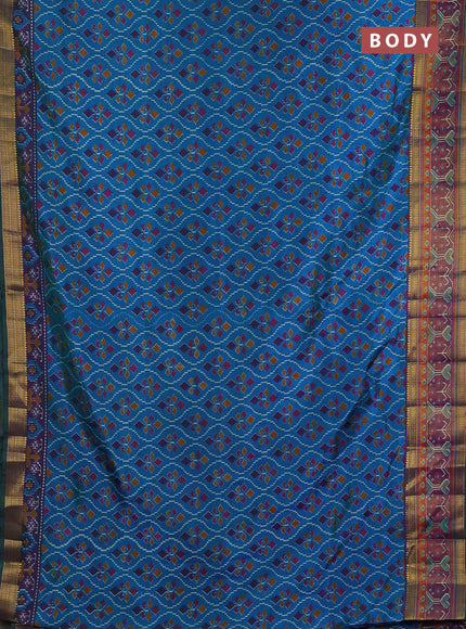Semi tussar saree dual shade of bluish green and purple with allover ikat prints and ikat woven zari border