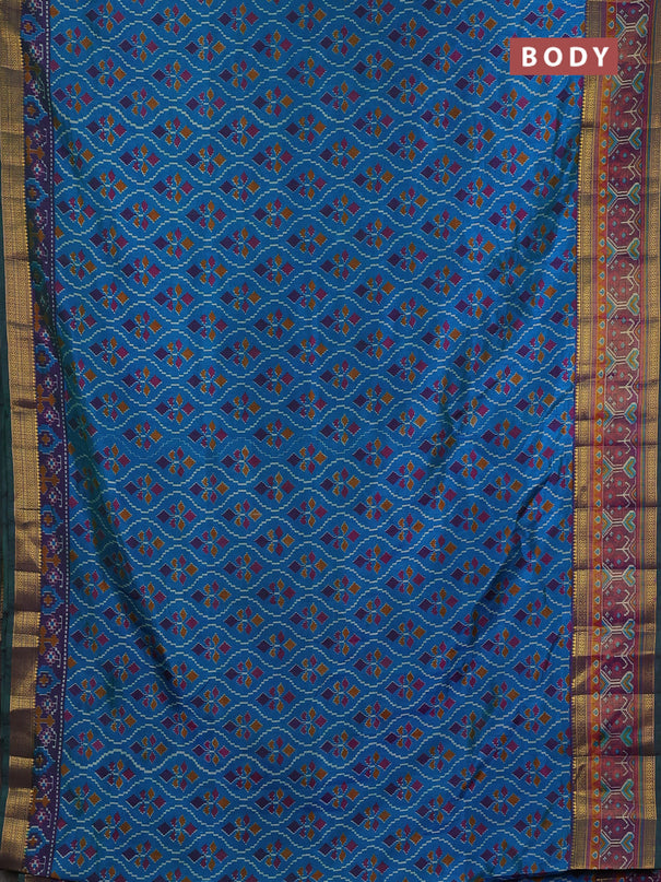 Semi tussar saree dual shade of bluish green and purple with allover ikat prints and ikat woven zari border