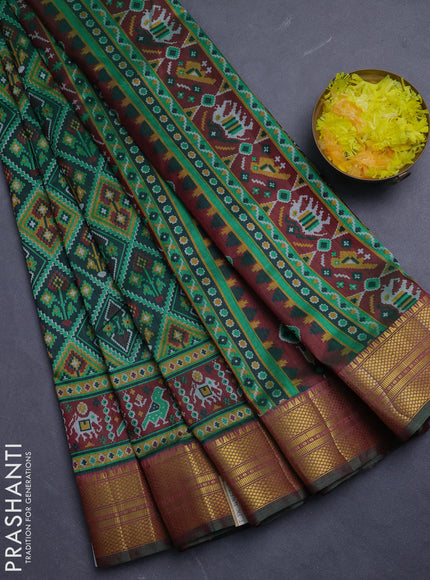 Semi tussar saree dark green and maroon with allover ikat prints and zari woven border