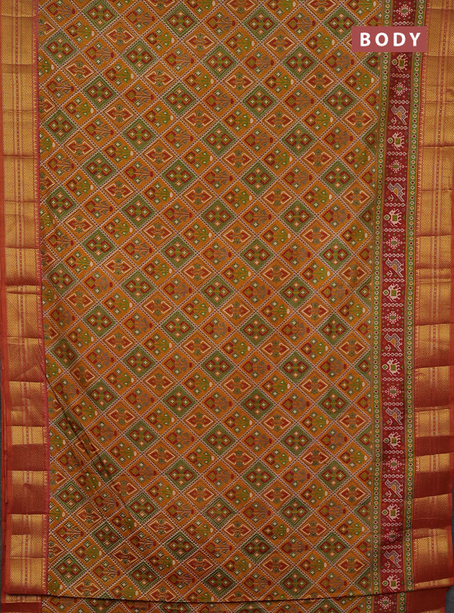 Semi tussar saree dark mustard and rust shade with allover ikat prints and zari woven border