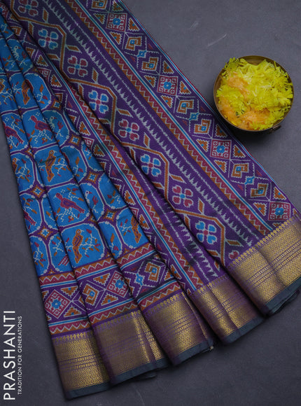 Semi tussar saree blue and purple with allover ikat prints and zari woven border