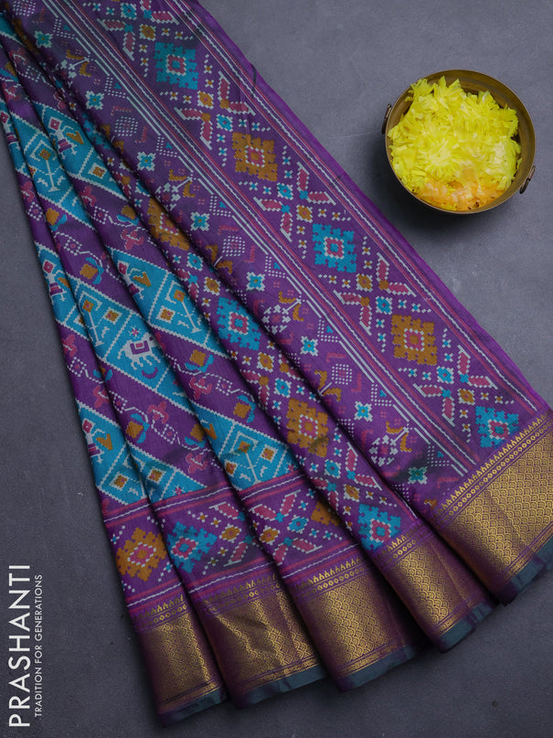 Semi tussar saree teal green and purple with allover patola prints and zari woven border