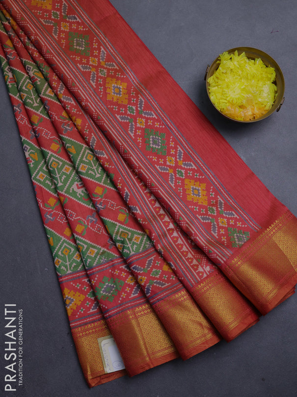 Semi tussar saree green and rust orange with allover patola prints and zari woven border