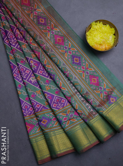Semi tussar saree purple and green with allover patola prints and zari woven border