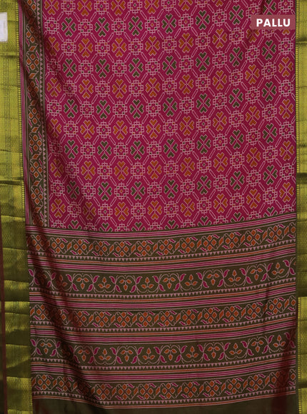 Semi tussar saree dual shade of pinkish orange and green with allover ikat prints and zari woven border