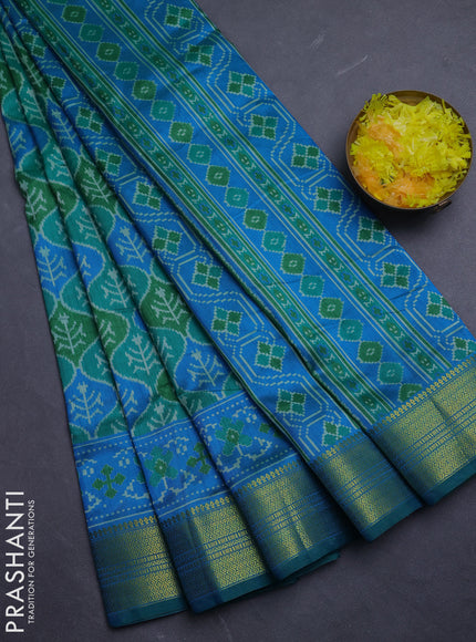 Semi tussar saree green and blue with allover ikat prints and zari woven border