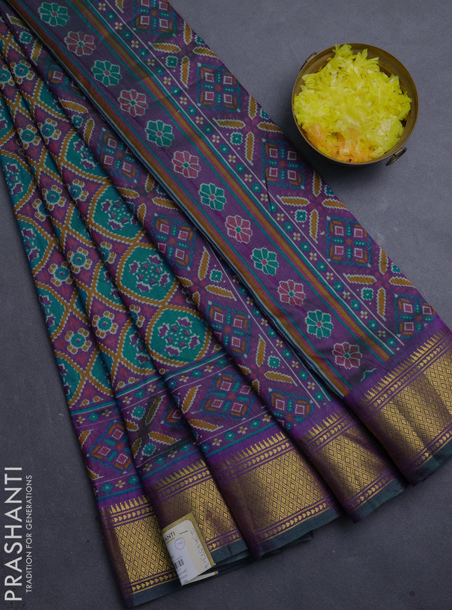 Semi tussar saree teal green and purple with allover ikat prints and zari woven border