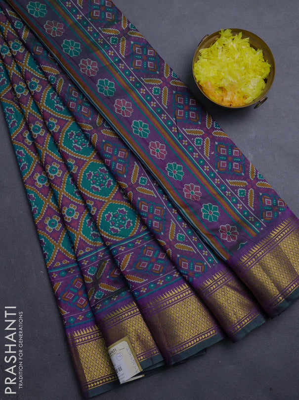 Semi tussar saree teal green and purple with allover ikat prints and zari woven border