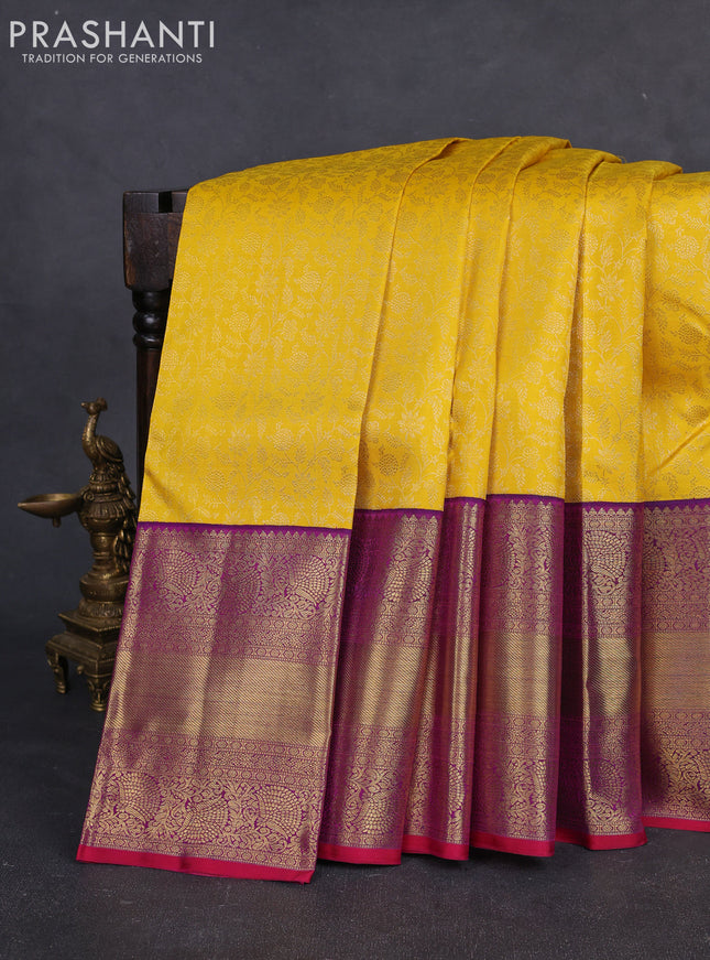 Pure kanchipuram silk saree yellow and purple with allover zari woven brocade weaves and long rich zari woven border