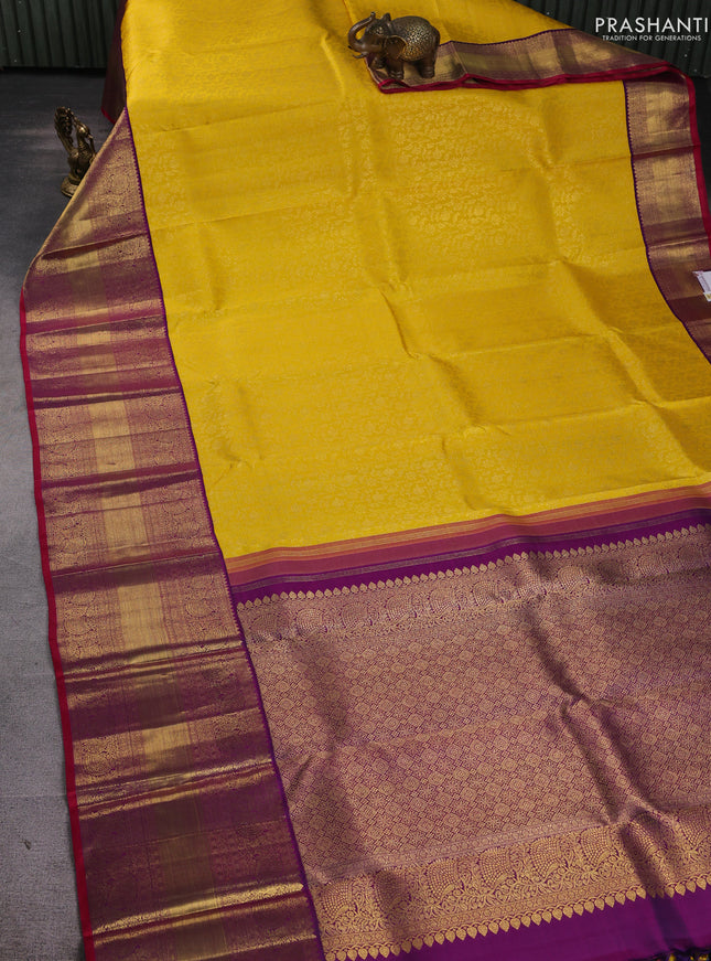 Pure kanchipuram silk saree yellow and purple with allover zari woven brocade weaves and long rich zari woven border