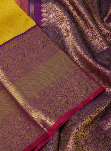 Pure kanchipuram silk saree yellow and purple with allover zari woven brocade weaves and long rich zari woven border