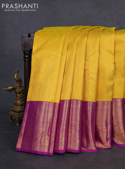 Pure kanchipuram silk saree yellow and purple with allover zari woven brocade weaves and long rich zari woven border