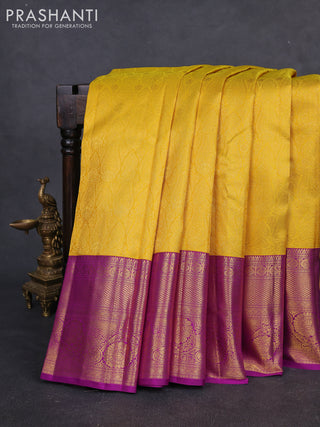 Pure kanchipuram silk saree yellow and purple with allover zari woven brocade weaves and long rich zari woven border