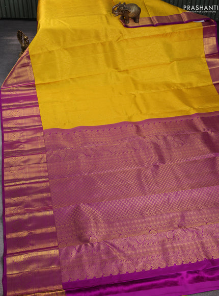 Pure kanchipuram silk saree yellow and purple with allover zari woven brocade weaves and long rich zari woven border