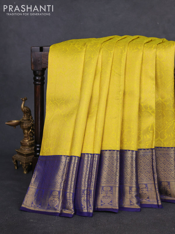 Pure kanchipuram silk saree yellow and navy blue with allover zari woven brocade weaves and rich zari woven border