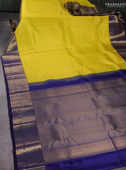 Pure kanchipuram silk saree yellow and navy blue with allover zari woven brocade weaves and rich zari woven border