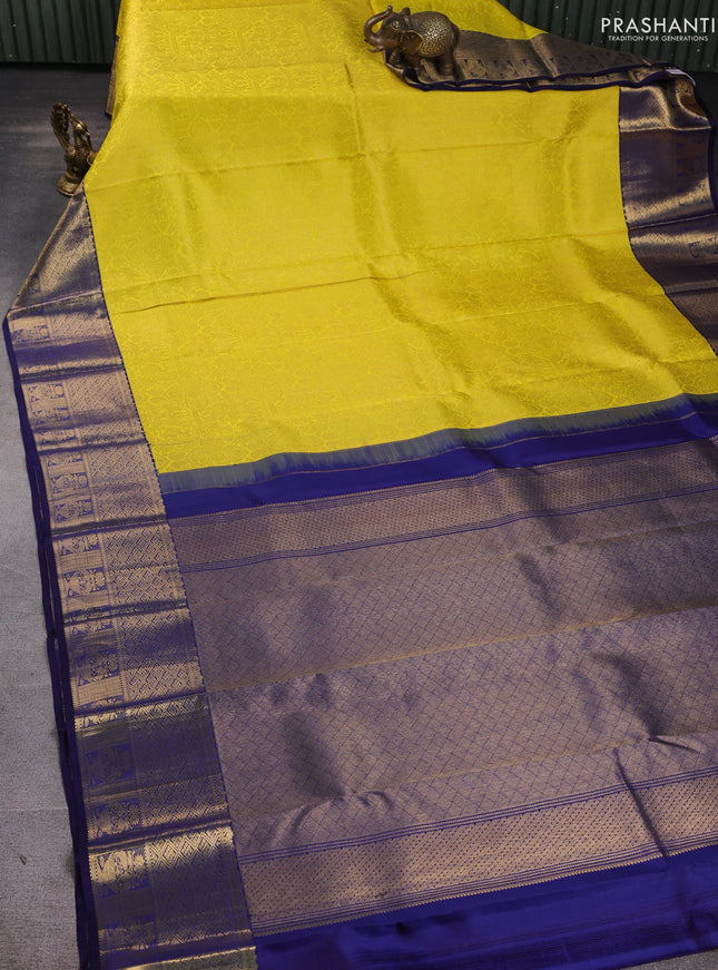 Pure kanchipuram silk saree yellow and navy blue with allover zari woven brocade weaves and rich zari woven border