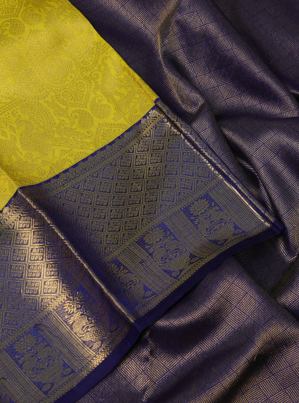 Pure kanchipuram silk saree yellow and navy blue with allover zari woven brocade weaves and rich zari woven border