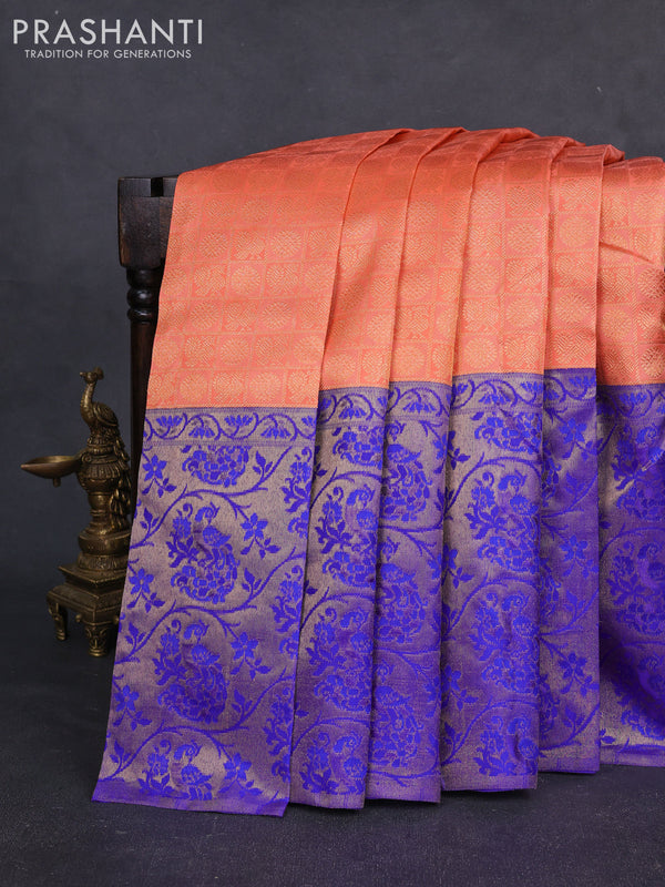 Pure kanchipuram silk saree peach orange and blue with allover zari woven brocade weaves and long zari woven banarasi border